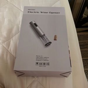 Secura NWOT electric wine opener. Brand new never opened intact in box! NWOT
